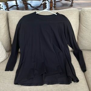 Long sleeve lululemon black swing top size 8 never worn.